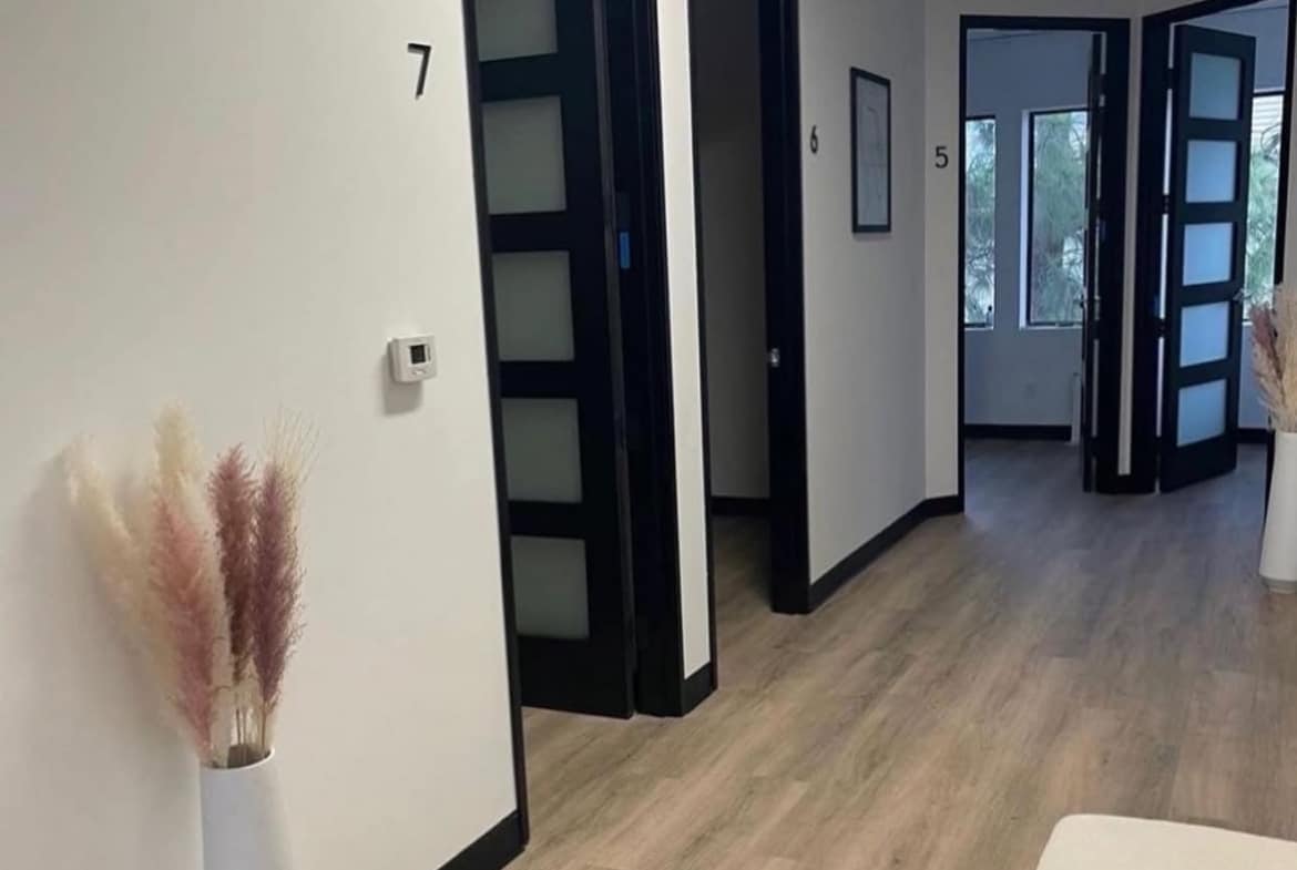 Stylish salon rental with private suites, contemporary decor, and flexible leasing options.