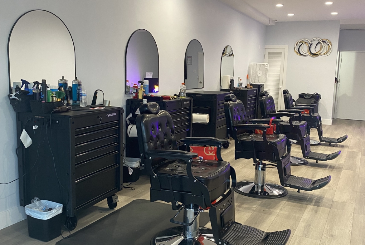 Stylish salon chairs at station with mirrors, perfect for professional hairstyling and beauty services.