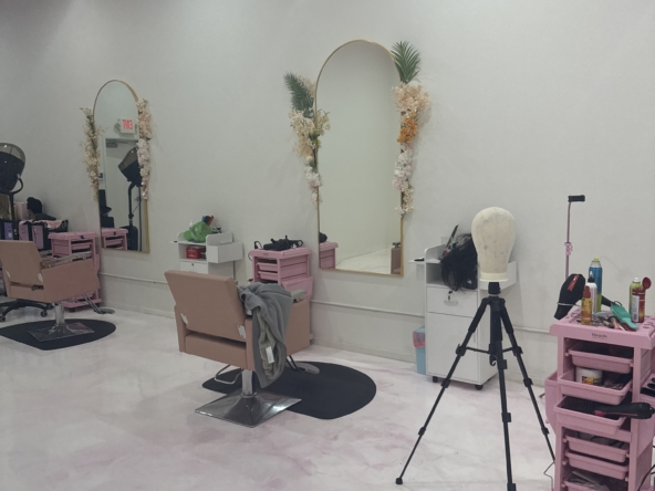 Stylish salon studio with pink chairs and decorations, ideal for beauty professionals and rental spaces.