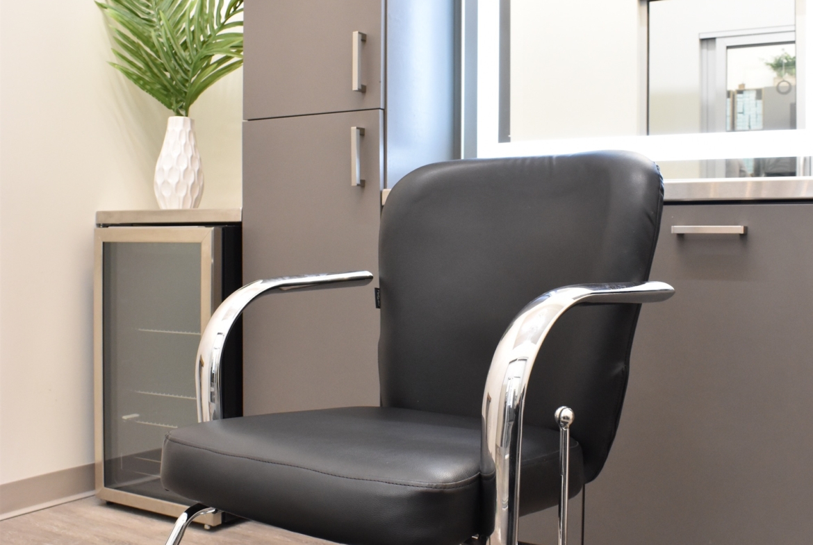 Professional salon chair for haircuts and styling in a modern salon setting.