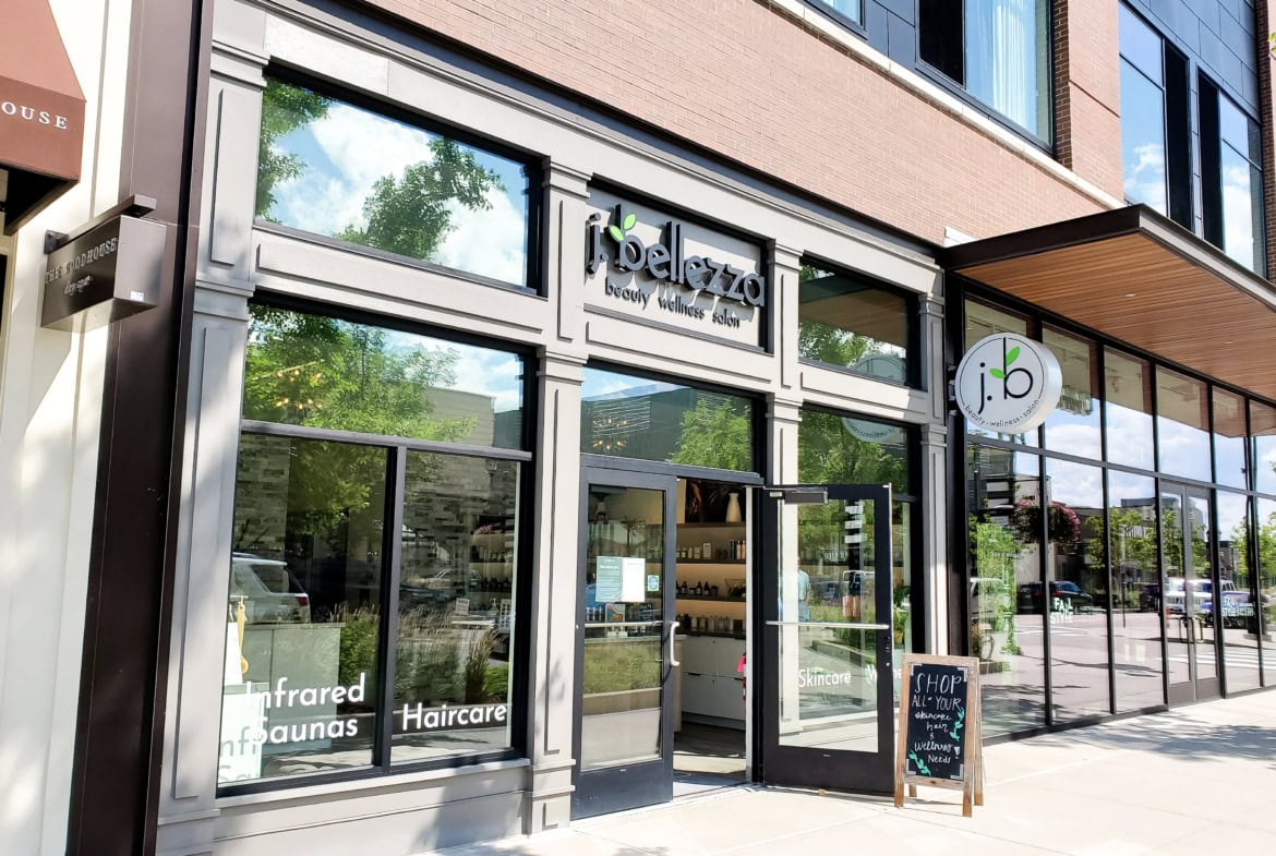 Bright, inviting salon entrance showcasing contemporary design and glass storefront.