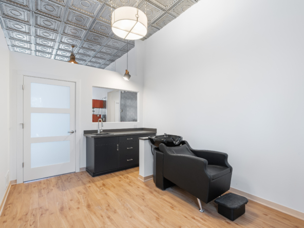 Modern salon shampoo station and styling area for rent.