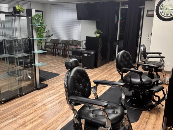 Salon Renter black barber chairs in stylish salon with wood floors and modern decor.