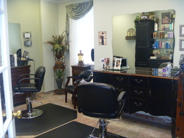 Stylish salon with seating, mirrors, and hair care products for a professional beauty environment.