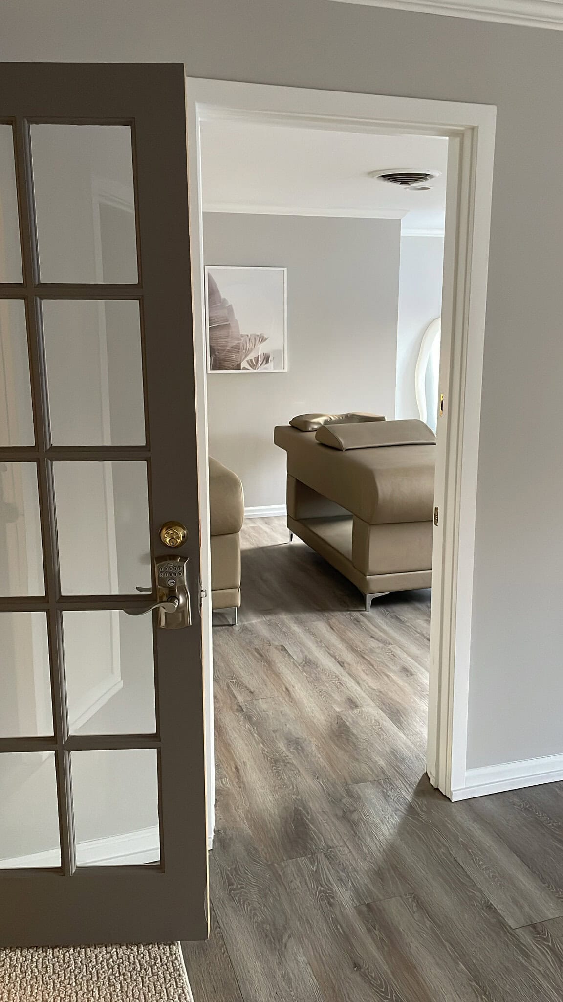 Relaxing massage room with massage table and calming decor.