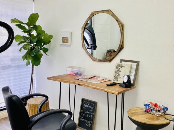 Salon Renter workspace with mirror and chair for beauty professionals.
