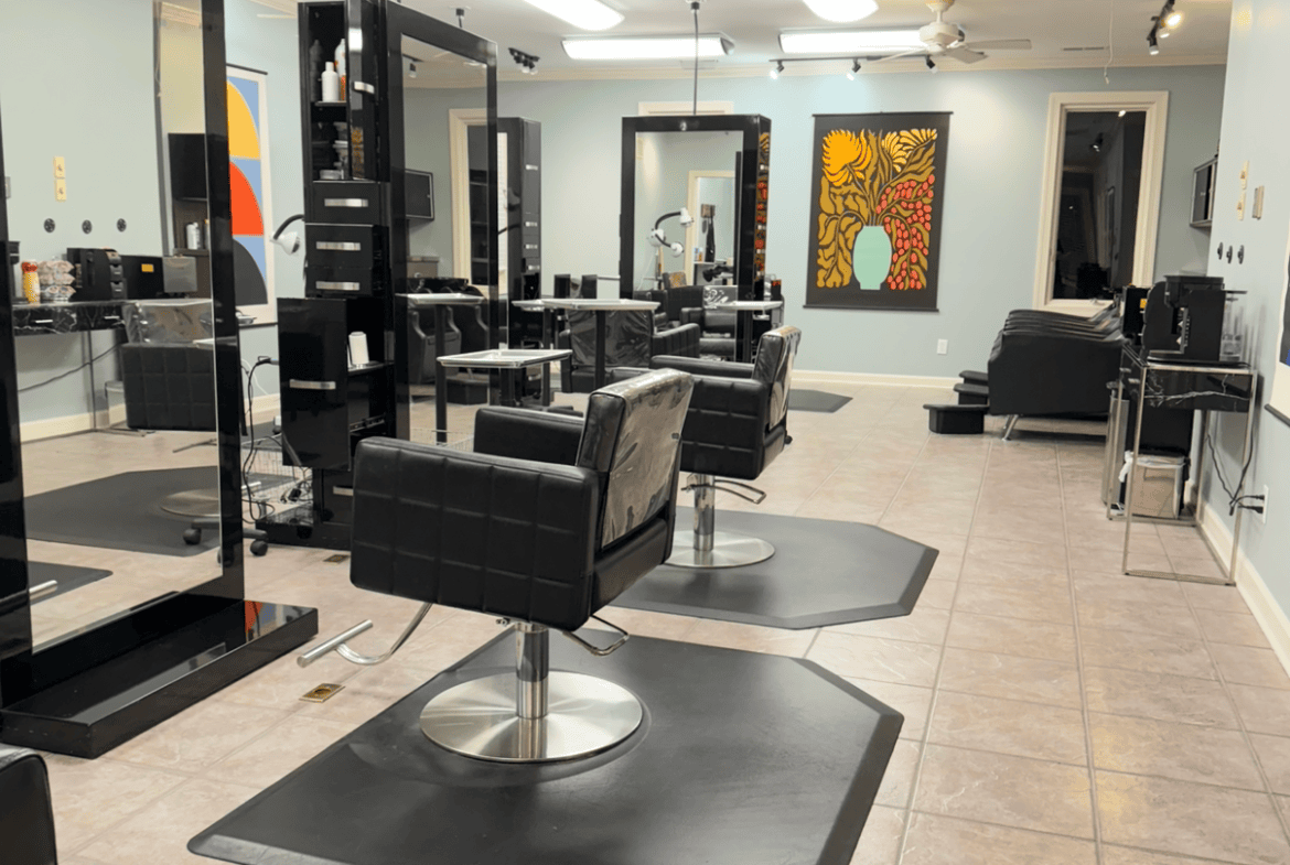 Stylish salon with modern styling stations and comfortable seating.