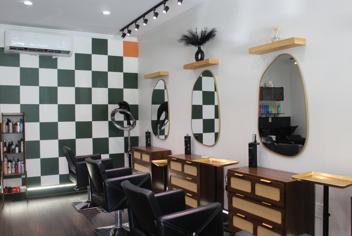 Interior of a modern hair salon with styling chairs, mirrors, and decor for a professional look.
