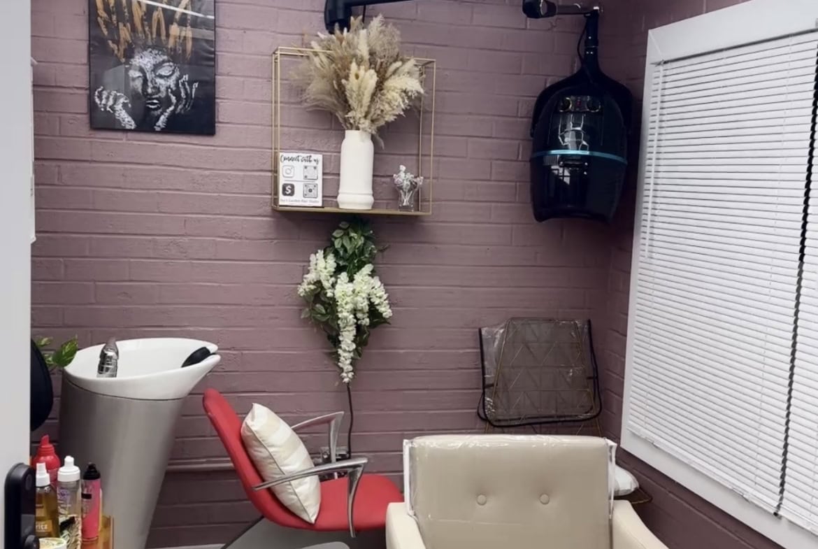 Salon Renter hair salon station with modern decor and comfortable seating.