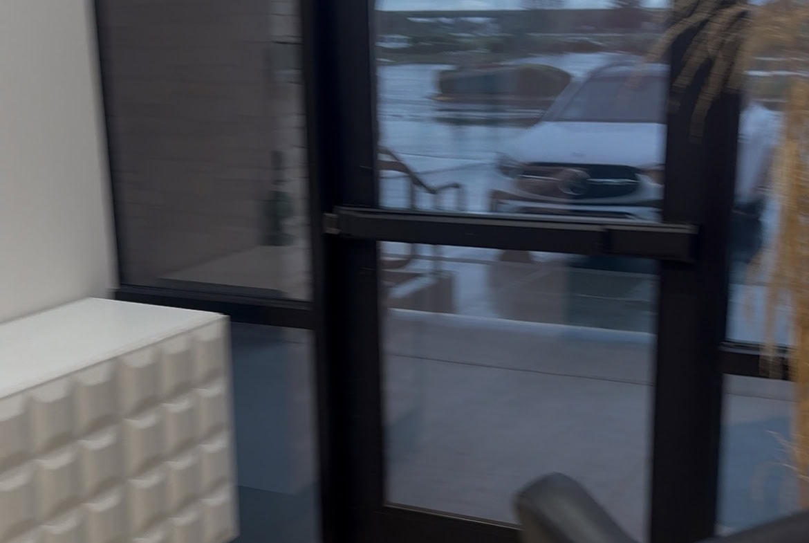 Office entrance with glass door at Salon Renter.