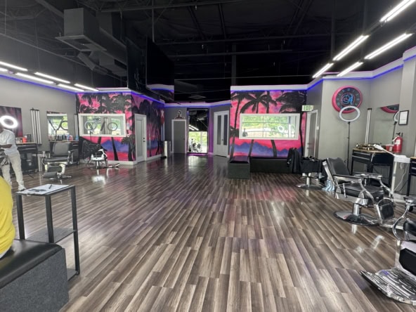Interior of a contemporary hair salon with styling chairs, mirrors, and vibrant decor. Perfect for h.