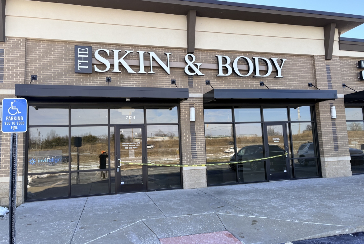 Skin & Body clinic storefront with large signage and glass doors.
