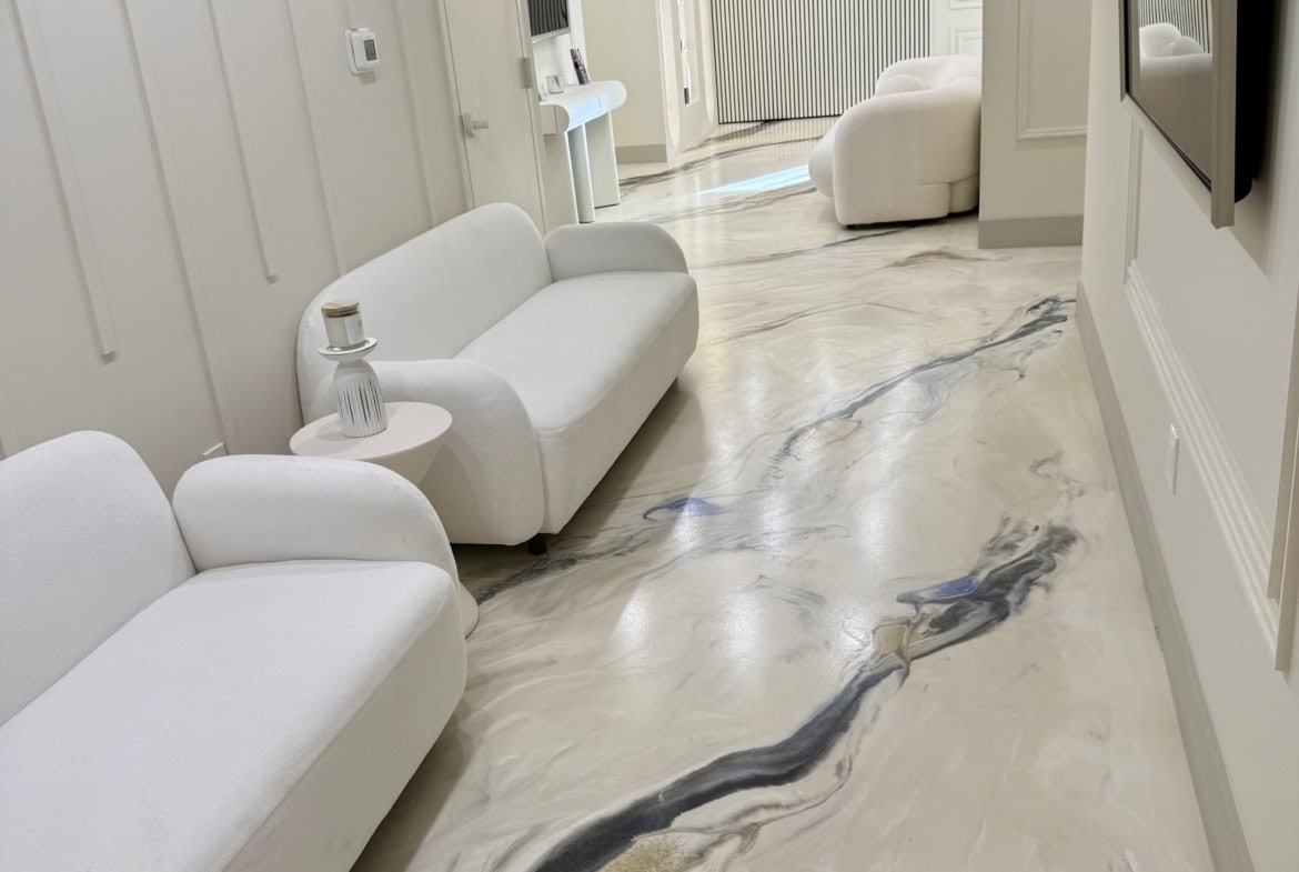 Elegant salon interior with comfortable white chairs and stylish decor.