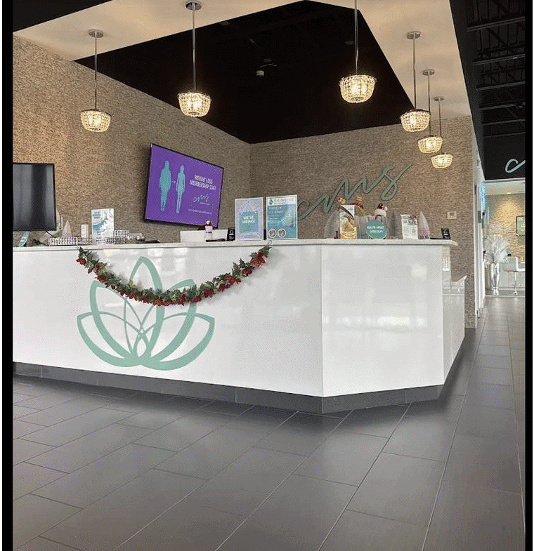Reception area at Salon Renter with contemporary design and lighting fixtures.